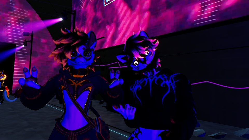Two avatars posing together under vivid purple and pink lighting.