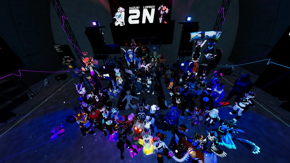 An overhead group view of avatars gathered around the stage and decks.